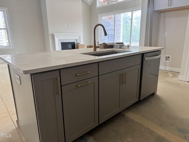 63 Daybreak Way, Fuquay Varina, NC 27526 - kitchen with a sink, gray cabinets, stainless steel dishwasher, and a center island with sink