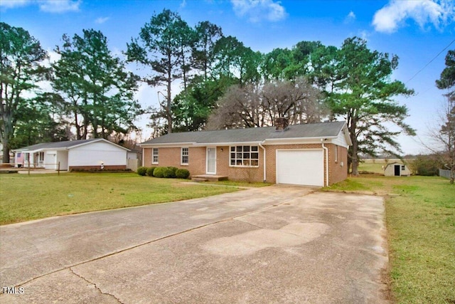 ranch-style home featuring a garage, driveway, brick siding, and a front yard