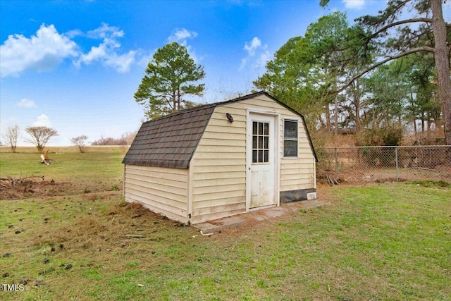 view of shed with fence