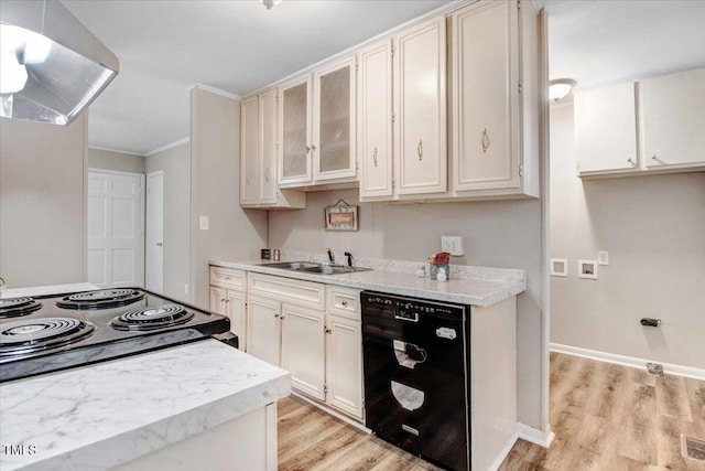 kitchen featuring light countertops, light wood-style floors, a sink, dishwasher, and extractor fan