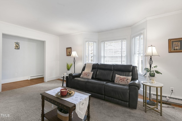 living room featuring baseboards, a baseboard radiator, wood finished floors, crown molding, and a baseboard heating unit