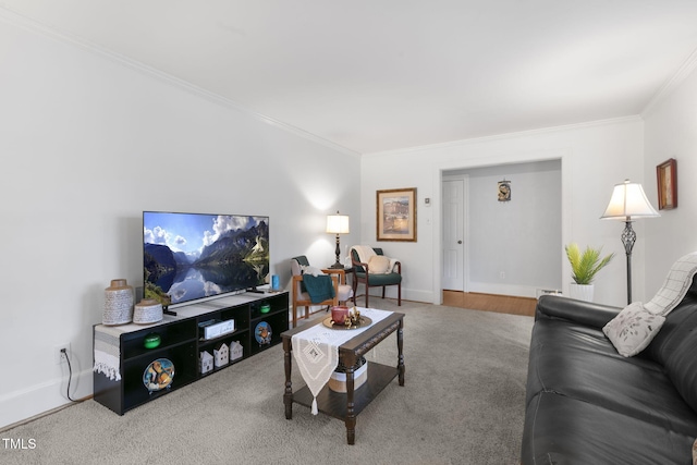 living room with ornamental molding, carpet, and baseboards