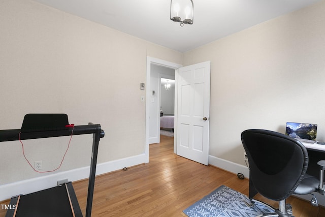 home office featuring light wood-style floors and baseboards