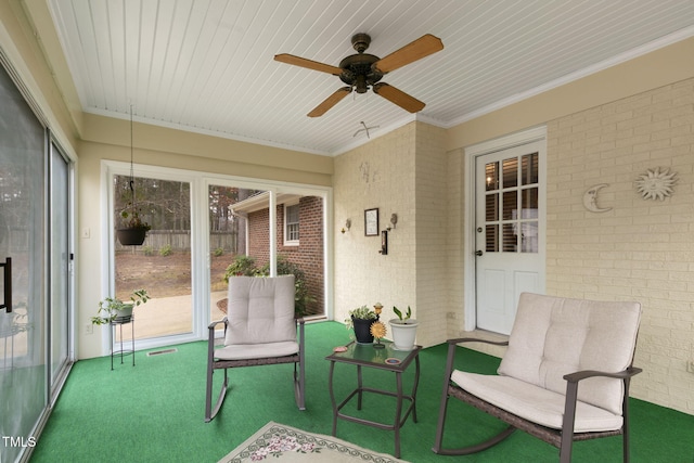 sunroom / solarium with ceiling fan and visible vents