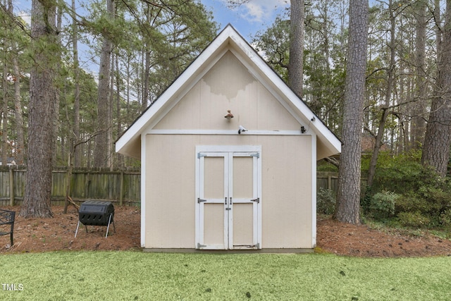 view of shed with fence