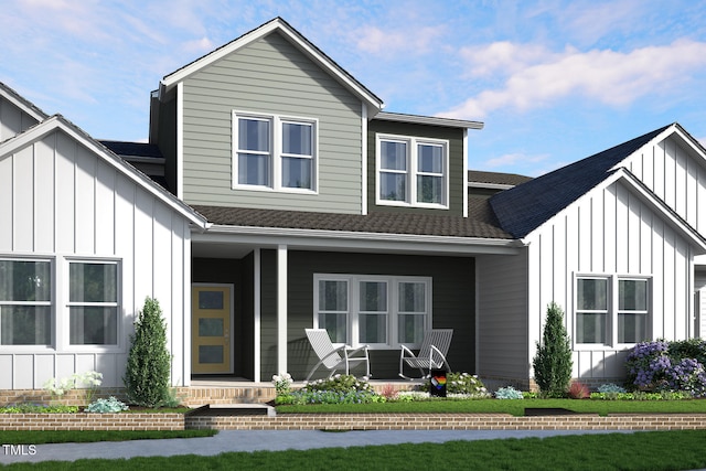 rear view of property with board and batten siding, covered porch, and a shingled roof