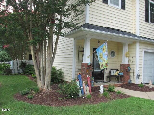 view of exterior entry featuring a porch