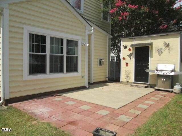 view of patio featuring area for grilling and an outdoor structure