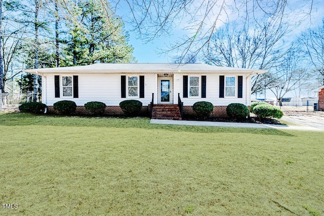 ranch-style house featuring crawl space, a front lawn, and fence