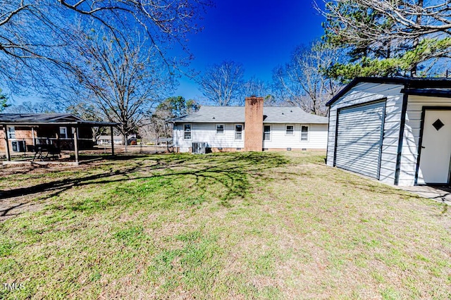 view of yard featuring an outbuilding and fence