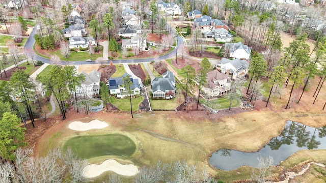 birds eye view of property with a residential view and a water view