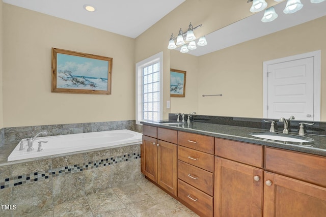 full bath with a bath, tile patterned floors, double vanity, and a sink