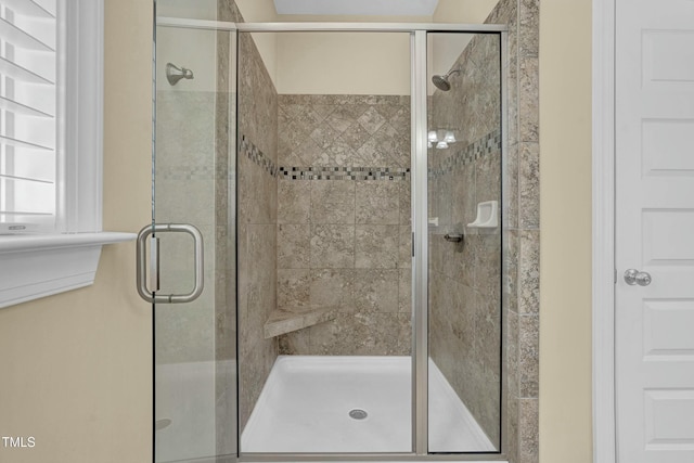 full bathroom with a shower stall