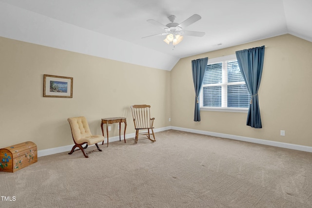 sitting room featuring carpet floors, a ceiling fan, baseboards, and vaulted ceiling