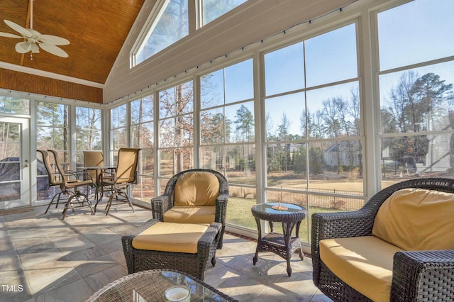 sunroom featuring wood ceiling, ceiling fan, and vaulted ceiling