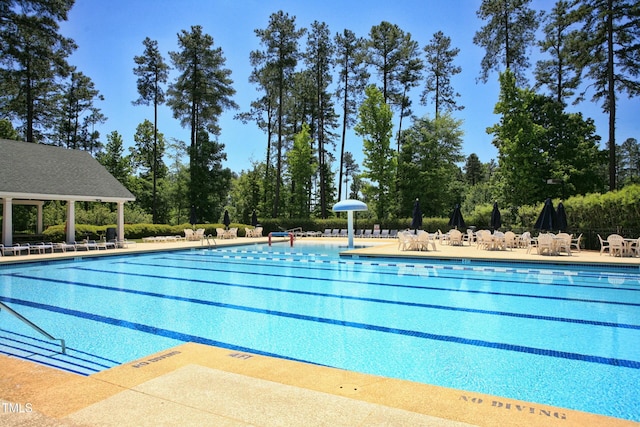 pool featuring a patio area