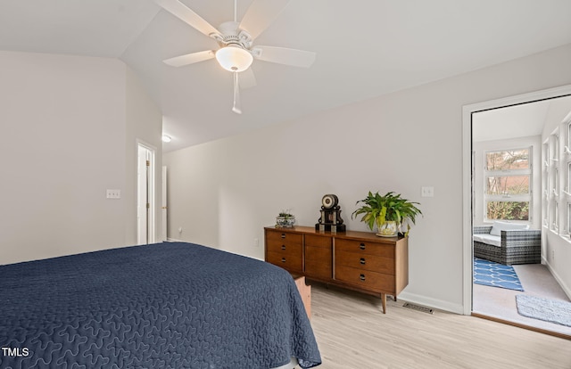 bedroom with a ceiling fan, baseboards, visible vents, vaulted ceiling, and light wood-type flooring