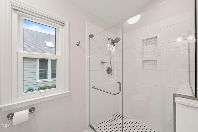 bathroom with a shower stall