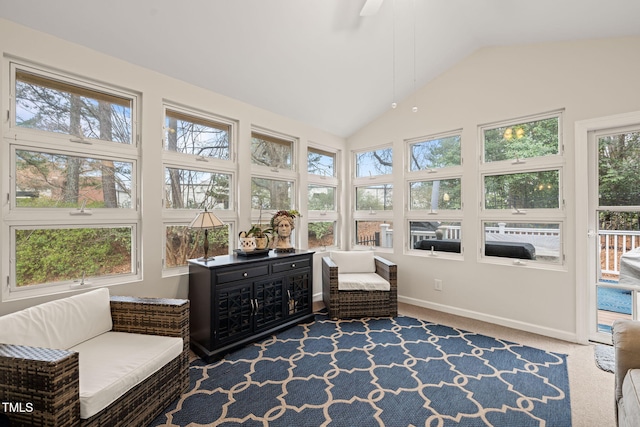 sunroom featuring vaulted ceiling