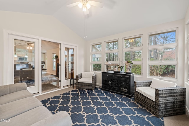 sunroom featuring lofted ceiling, a healthy amount of sunlight, and ceiling fan