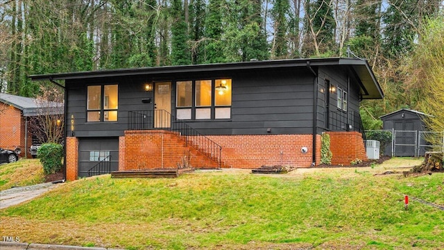 view of front of house featuring concrete driveway, an attached garage, fence, a front lawn, and brick siding