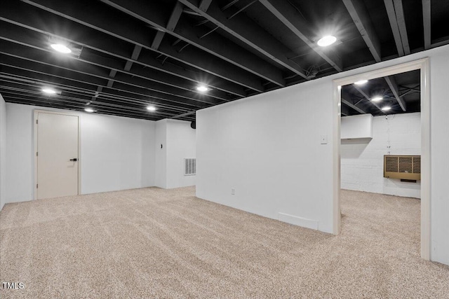 finished basement featuring carpet floors and visible vents