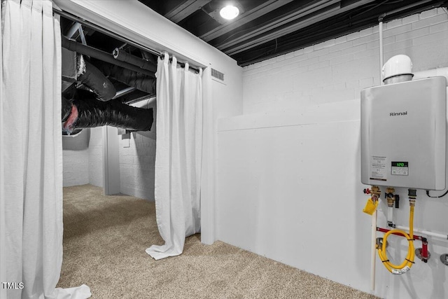 interior space featuring water heater and visible vents