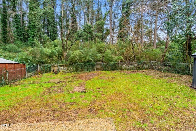 view of yard with a fenced backyard