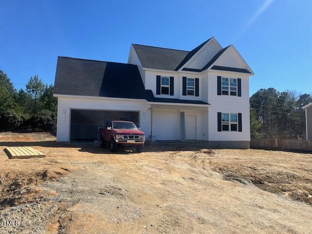 view of front of house with a garage and driveway