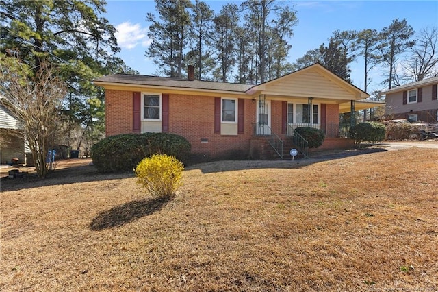 single story home with brick siding, crawl space, and a front lawn