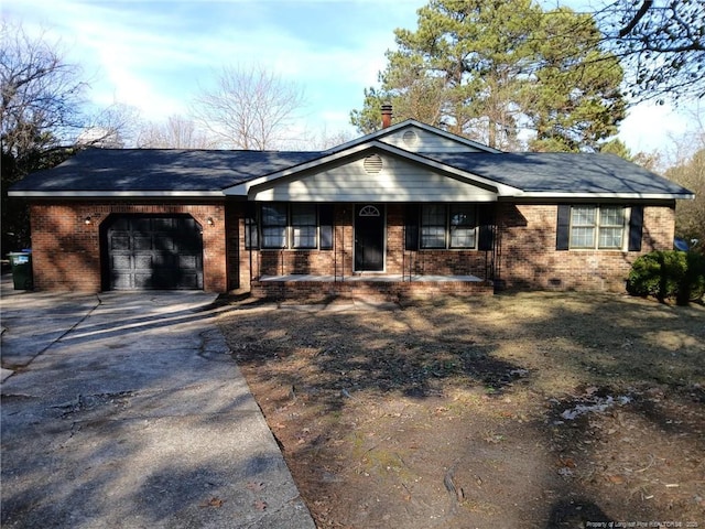 ranch-style house with a garage, covered porch, concrete driveway, and brick siding