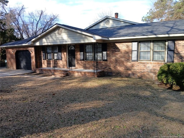 ranch-style house with crawl space, covered porch, an attached garage, and brick siding