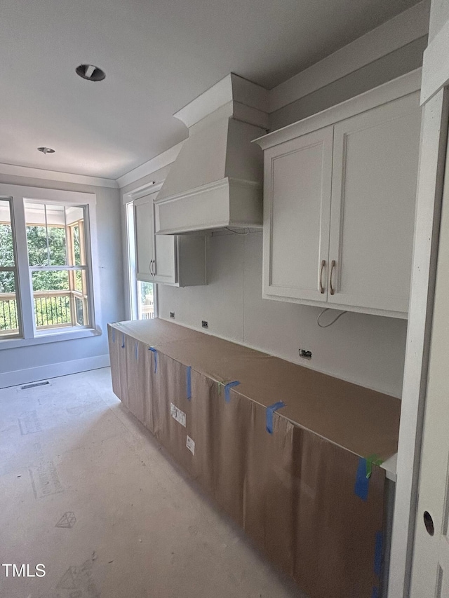 108 Pointe Park Cir, Holly Springs, NC 27540 - kitchen featuring custom exhaust hood, white cabinets, and baseboards
