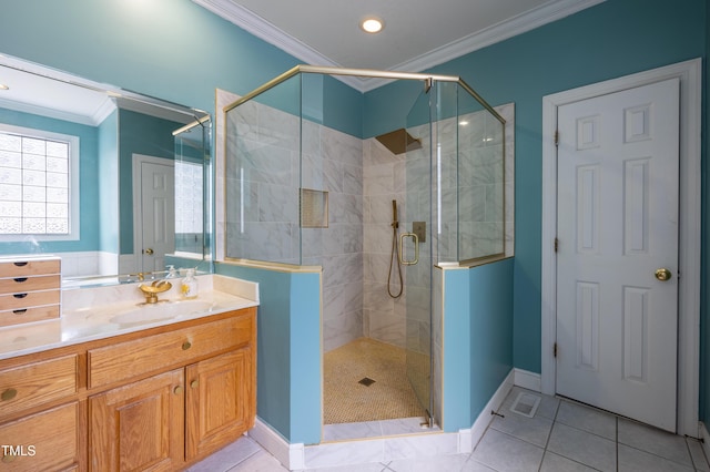 bathroom featuring vanity, a shower stall, crown molding, and tile patterned flooring