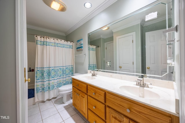 full bathroom with tile patterned floors, toilet, crown molding, and a sink