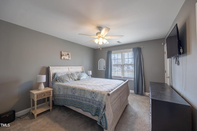 bedroom with baseboards, light carpet, visible vents, and ceiling fan