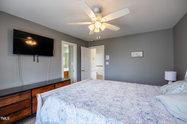 bedroom featuring ensuite bath and ceiling fan