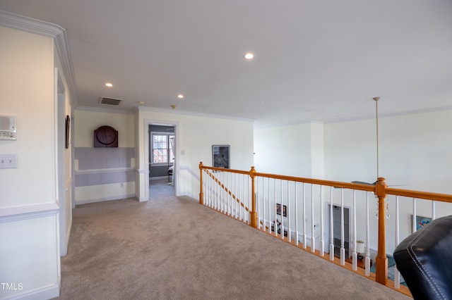 hall with visible vents, an upstairs landing, recessed lighting, carpet flooring, and crown molding