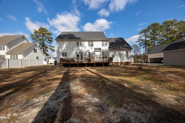 back of property featuring a wooden deck, fence, and crawl space