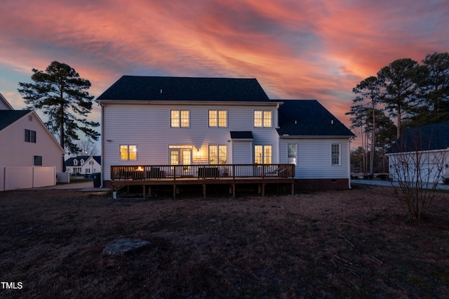 back of house featuring a deck