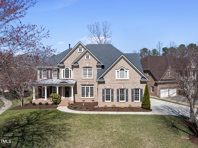 view of front facade featuring a front lawn, brick siding, and crawl space