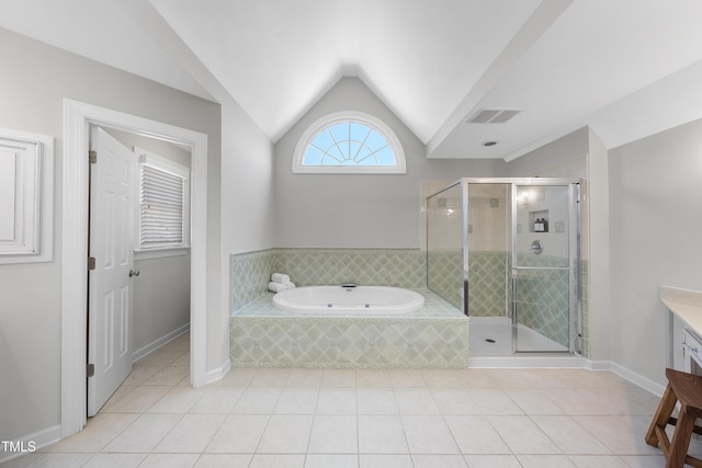 bathroom with visible vents, vaulted ceiling, a shower stall, a garden tub, and tile patterned floors