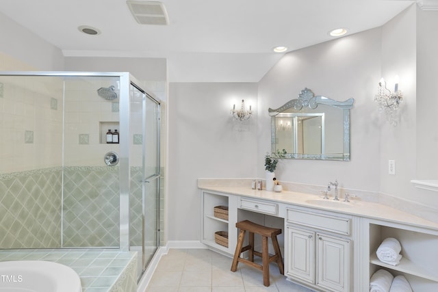 bathroom with tile patterned floors, visible vents, a stall shower, a washtub, and vanity