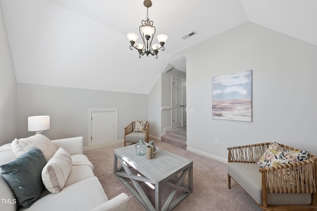 carpeted living area with a notable chandelier, visible vents, baseboards, and lofted ceiling