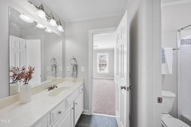 bathroom with baseboards, toilet, ornamental molding, tile patterned floors, and vanity