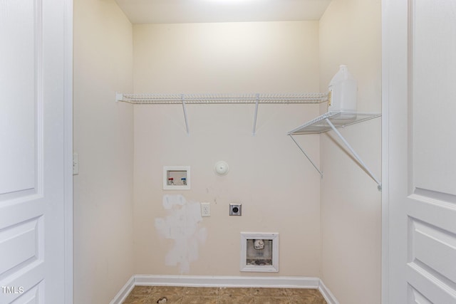 laundry area with laundry area, baseboards, hookup for a gas dryer, hookup for an electric dryer, and washer hookup