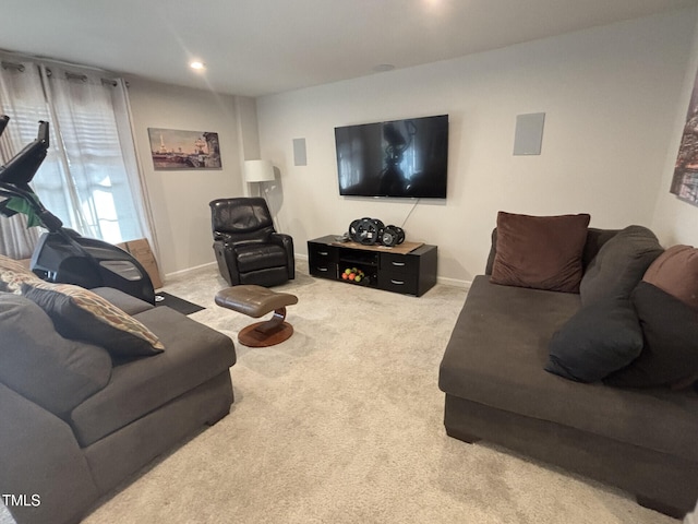 living area featuring carpet floors and baseboards