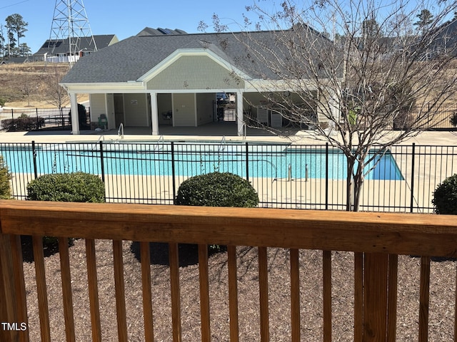 pool featuring a patio and fence