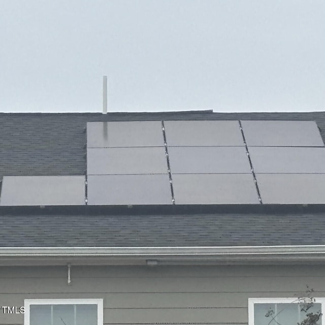 details featuring a shingled roof