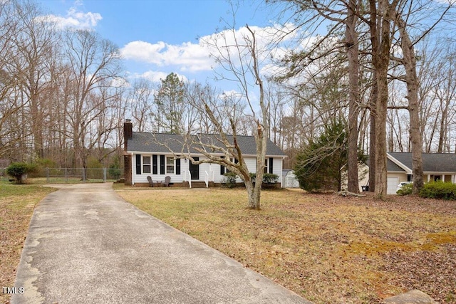 ranch-style home with fence, driveway, a chimney, a front lawn, and crawl space